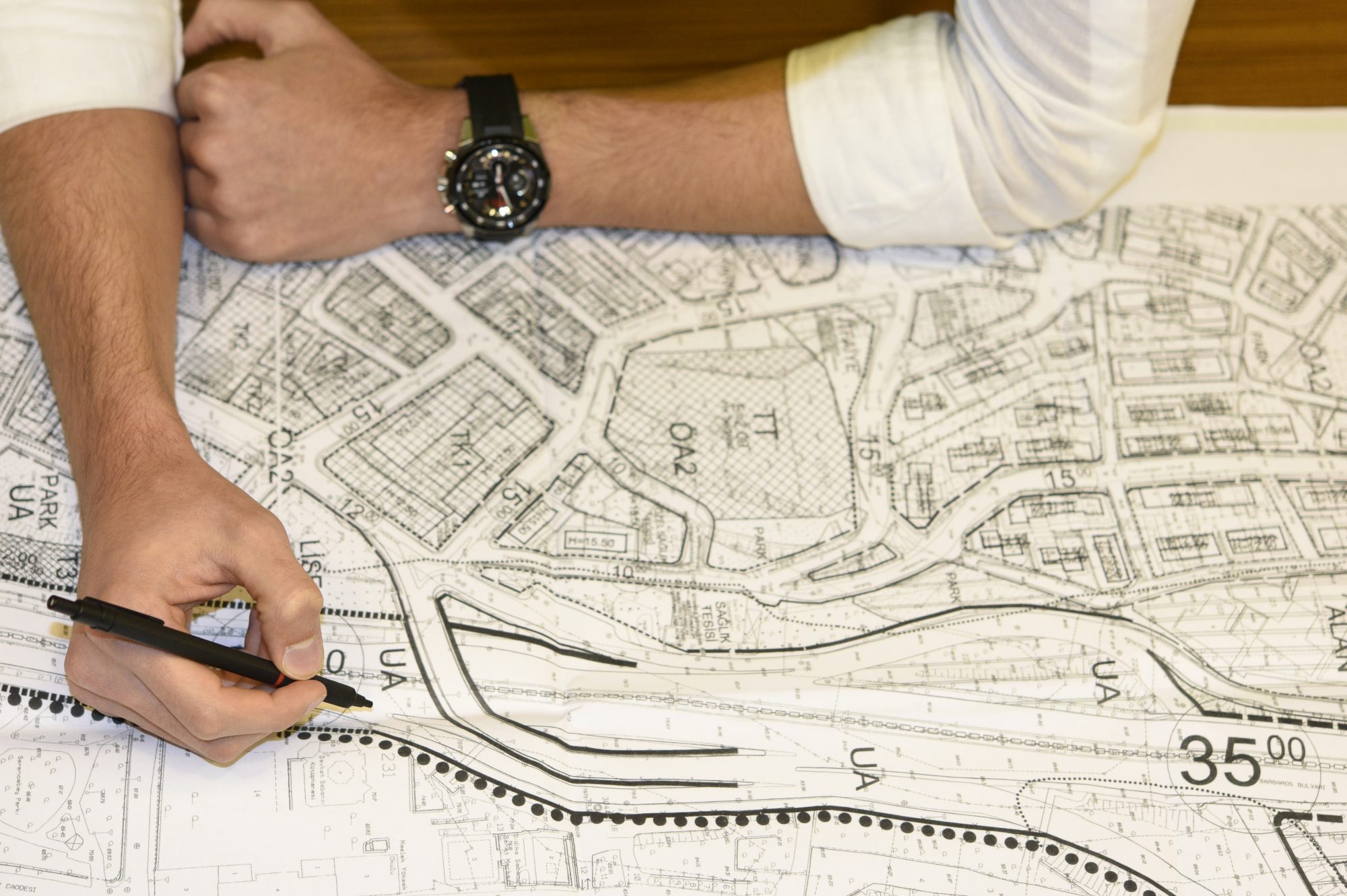 Civil engineer working at blueprints